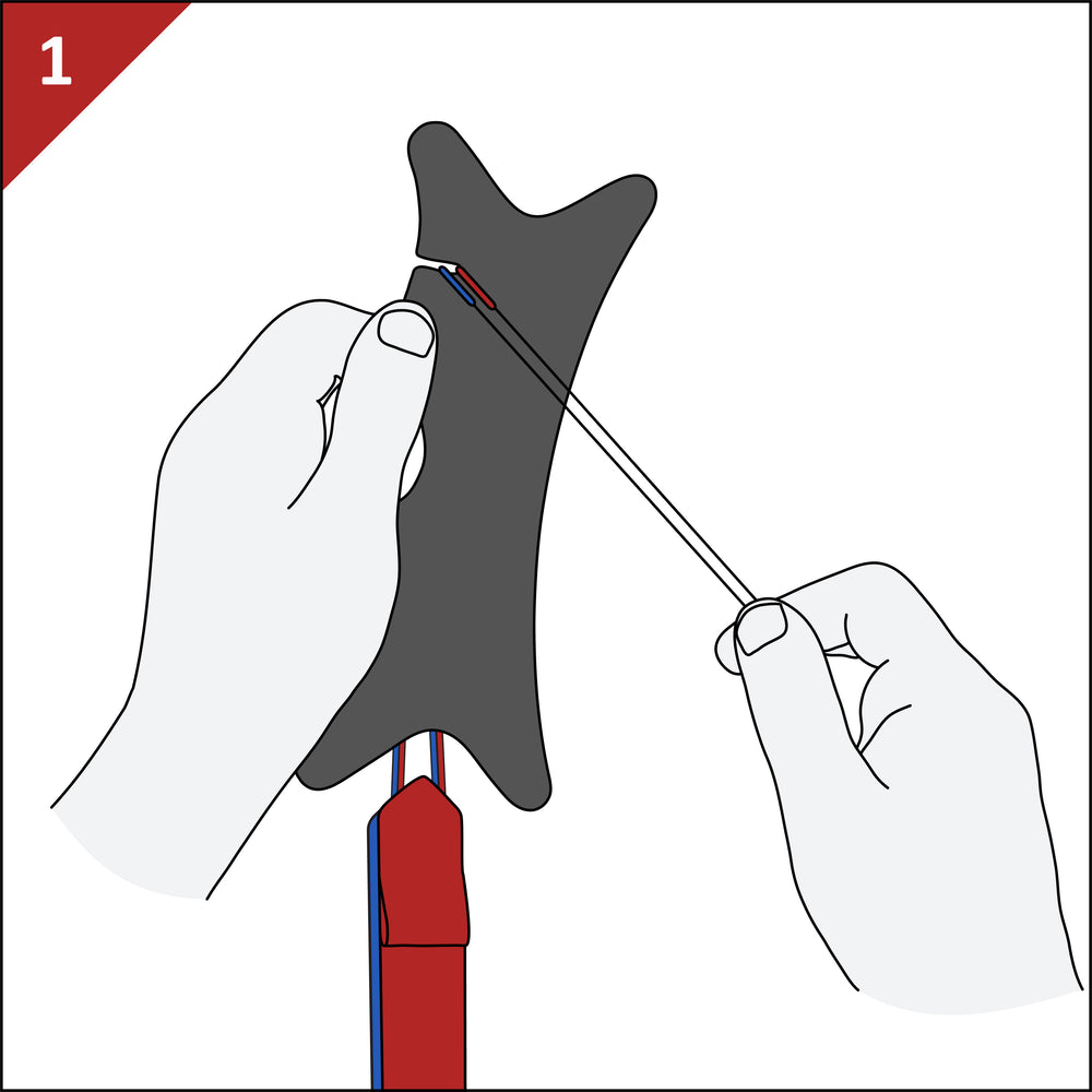Step 1: hook both wrist-strap cords into the winder's slot.