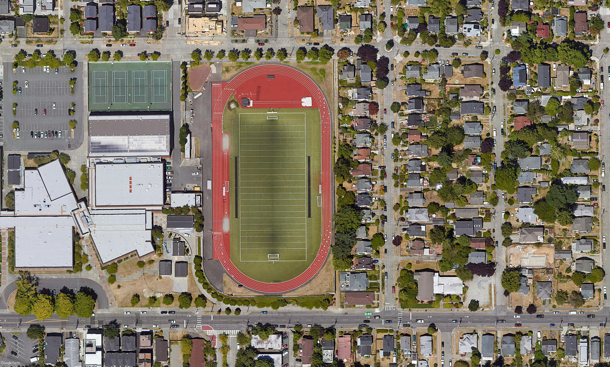 School football field surrounded by low buildings