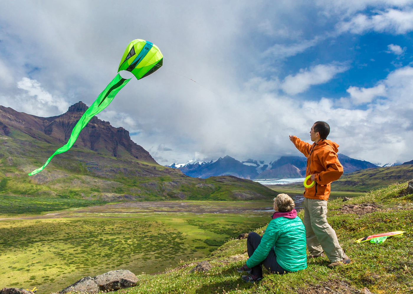 Two people fly a Bora 7 parafoil in the Alaskan wilderness