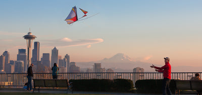 Justin flying a Zero G glider with Seattle skyline in the background