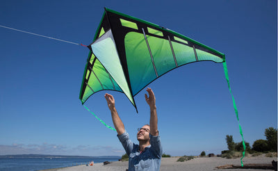 Handsome man launching Zenith 5 at the beach