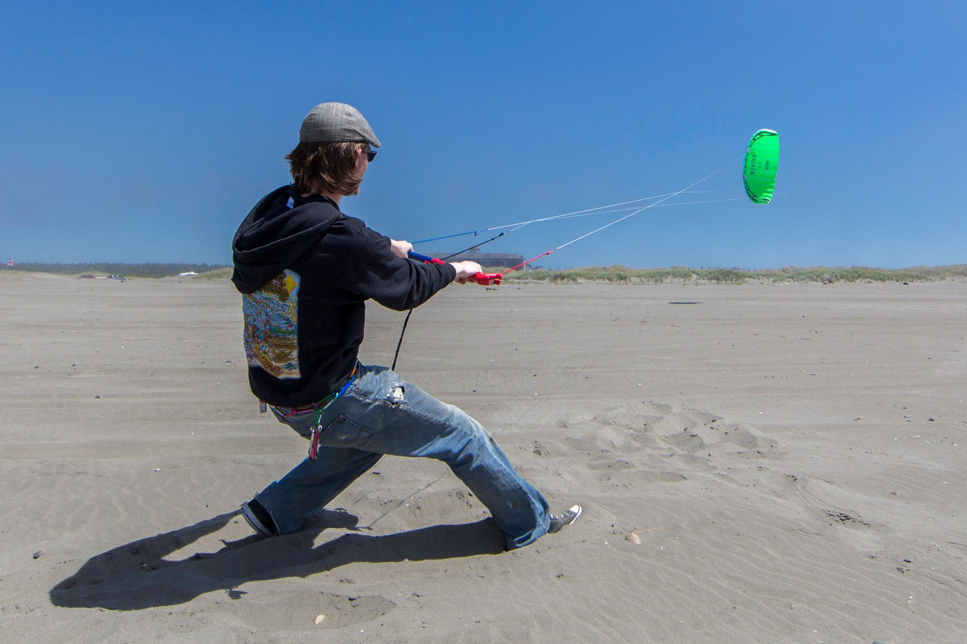 Man flying Mentor power kite on beach