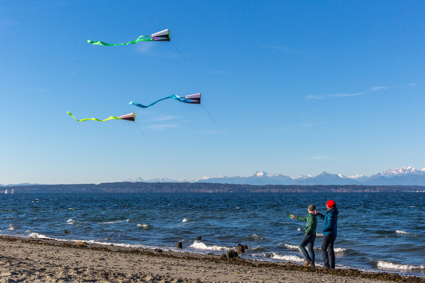 Two men flying Pocket Flyers at the beach