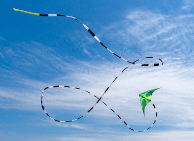 Citrus Quantum with 75 foot black and white tube tail in flight